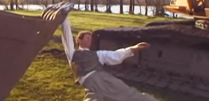 JUST A MAN DANCING W/ AN EXCAVATOR